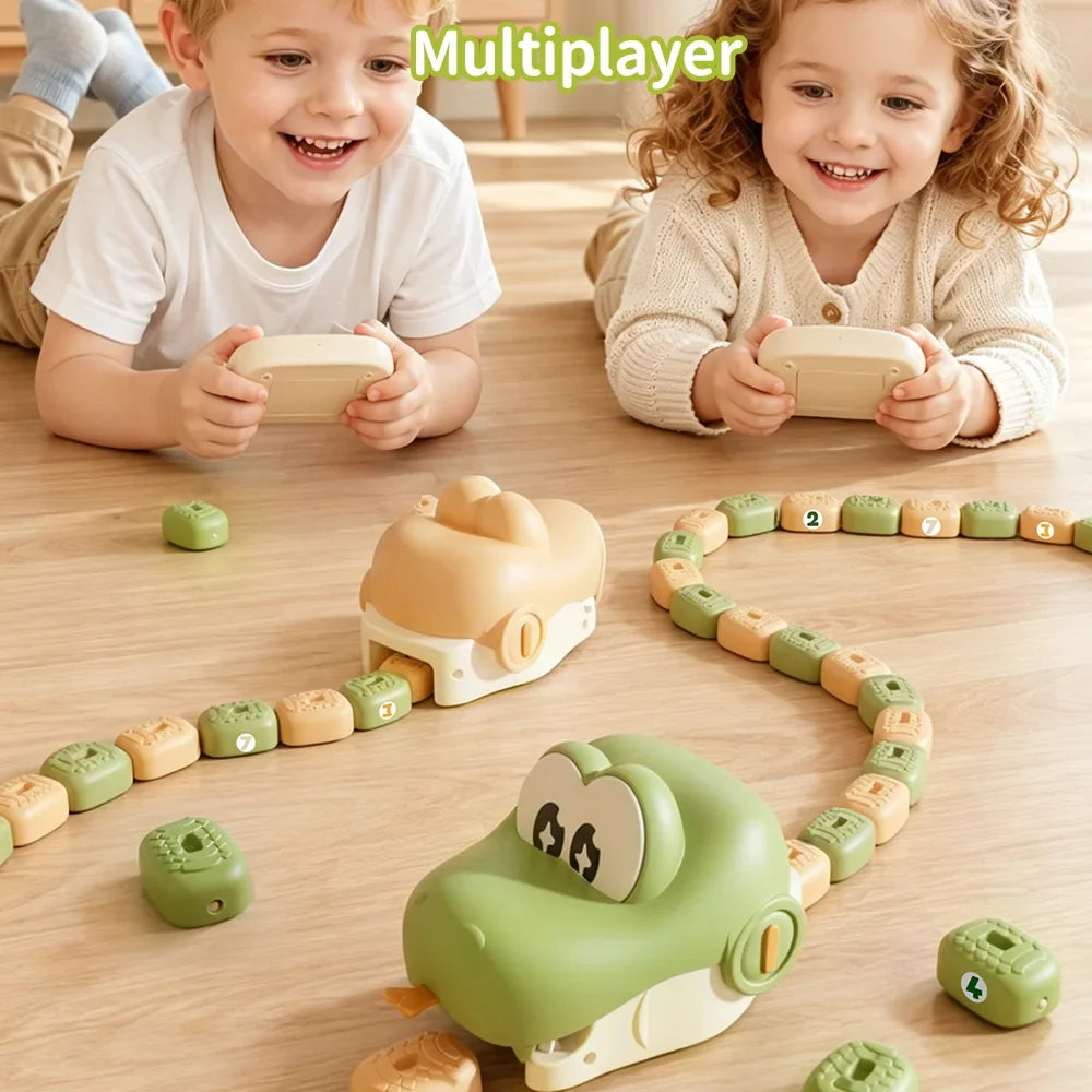 Children playing with green and beige magnetic remote control snake toys